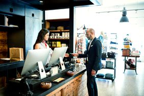 A discounted transaction at the register of a men's clothing store.