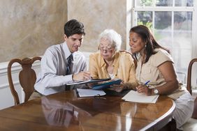 Parent and adult child talk to an attorney