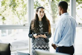 Woman in discussion with a client in an office