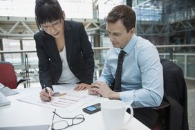 Business people reviewing data in meeting