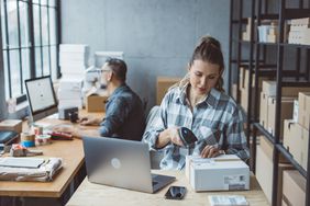 Two people do business tasks.