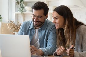 Couple doing taxes together at home