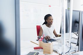 A person sits at a computer,