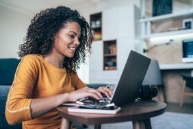 An investor checks information on a laptop