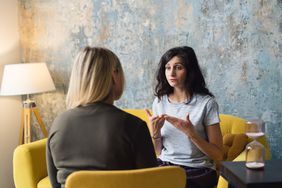 A psychologist talks with a patient.