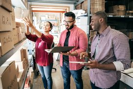 Small business owners doing inventory and paperwork