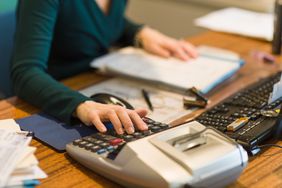 Accountant punching numbers