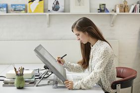 Graphic designer working at desk