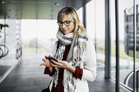 A woman checks her loan consolidation application.