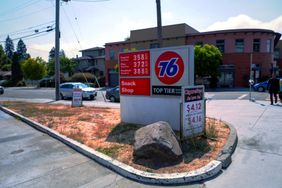 Sign shows the prices for gasoline listed at a gas station