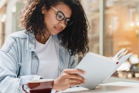 A person looks into a journal.