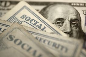 Social Security Cards On Top Of $100 Bill