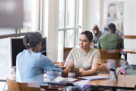 Woman discussing a business loan with a bank lender.