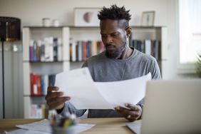 A person looks at paperwork.