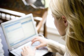 Woman working on laptop computer